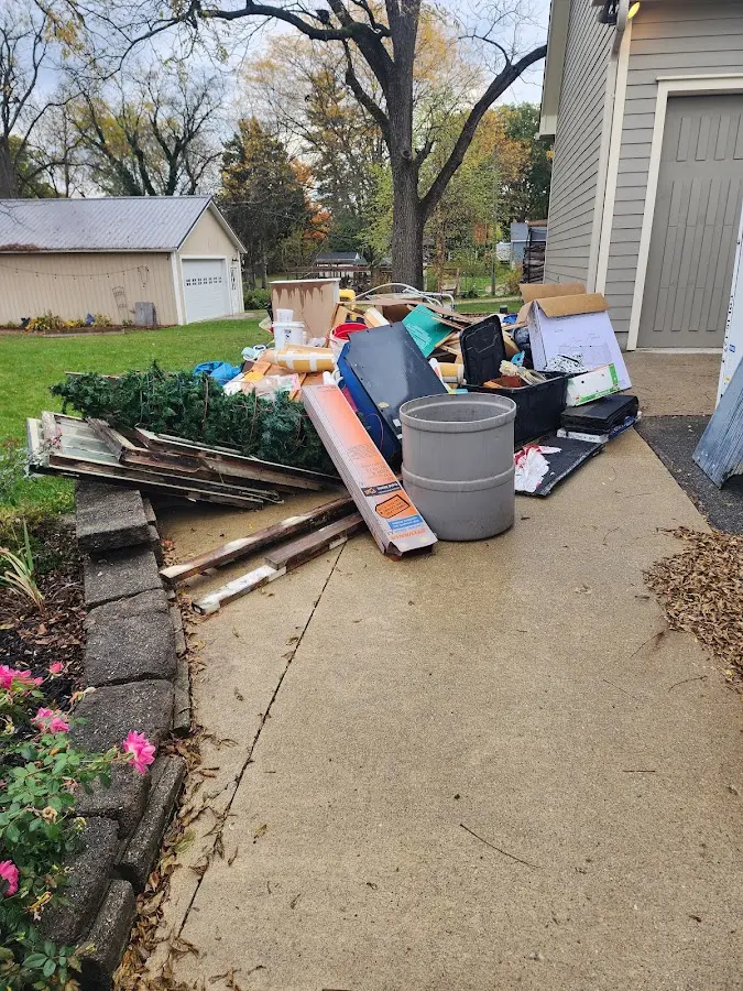 Dumpster being loaded with debris for Commercial Dumpster Rental in Selma
